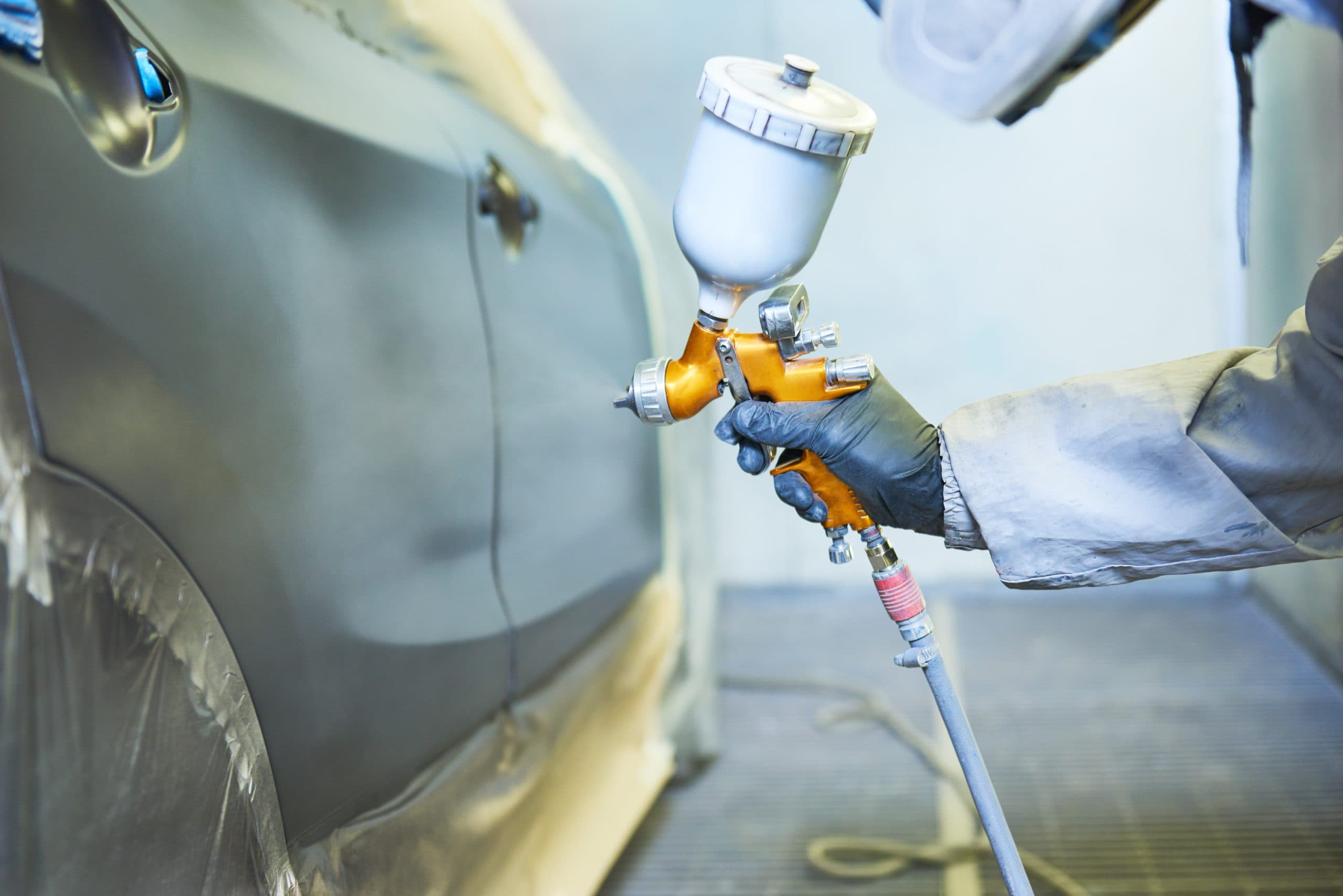 UltraColor Systems technician applying paint